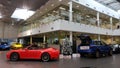 Moscow. Winter 2019. New year in Porsche Center. 911 Carrera and Macan near christmas tree. Presents in the trunk Royalty Free Stock Photo