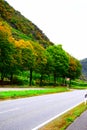 Mosel valley road with autumn trees at parking lot Lehmen Schleuse