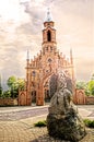 Moses statue and a gothic church in a background, Kernave, Lithuania