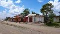 Country village made of recycled materials on the roadside in Tanzania with shops and small homes for local people