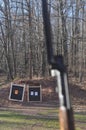 Mosin Nagant Gun Rifle with Targets in Focus in the Background Royalty Free Stock Photo