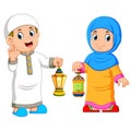 Moslem couple holding lantern