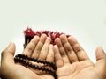 Moslem man praying using wooden beads Royalty Free Stock Photo