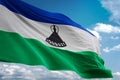 Lesotho national flag waving blue sky background realistic 3d illustration