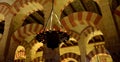 Mosque -Cathedral of Cordoba, Spain. Detailed view from below of the notable colored columns and arches of the main hall