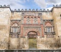 The Mosque Cathedral in Cordoba, Spain. Exterior wall with great golden door - famous landmark in Andalusia Royalty Free Stock Photo