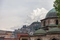 Mosque from the city center of Sarajevo, Bosnia and Herzegovina, with a typical background of Sarajevo with small houses on a hill Royalty Free Stock Photo