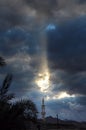 Mosque in dask. Sunlight through clouds Royalty Free Stock Photo