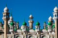 Mosque green domes and minaret towers