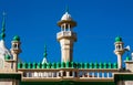 Mosque green domes and minaret towers