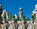 Mosque green domes and minaret towers