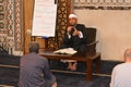 A mosque Imam preacher gives a lecture on the prophetic biography and the prophet practices and Sunnah