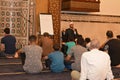 A mosque Imam preacher gives a lecture on the prophetic biography and the prophet practices and Sunnah