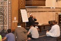 A mosque Imam preacher gives a lecture on the prophetic biography and the prophet practices and Sunnah