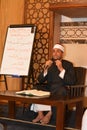 A mosque Imam preacher gives a lecture on the prophetic biography and the prophet practices and Sunnah