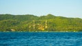 Mosque in island big green with deep blue dark sea view in distance in karimun jawa