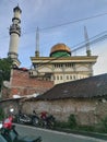 This mosque is in the middle of a very busy public settlement