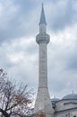 White mosque minaret. Mosque minaret with blue sky. Islamic background. The pillar architecture of the mosque Royalty Free Stock Photo