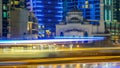 Mosque among modern high rise buildings, towers and hotels timelapse at Dubai Marina, United Arab Emirates, Middle East Royalty Free Stock Photo