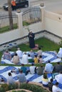 A mosque preacher Imam performs Eid Al Adha Khutbah (sermon) in an open air space near the mosque,