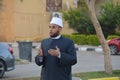 A mosque preacher Imam performs Eid Al Fetr Khutbah (sermon) in an open air space near the mosque,