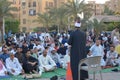 A mosque preacher Imam performs Eid Al Fetr Khutbah (sermon) in an open air space near the mosque,