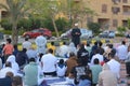 A mosque preacher Imam performs Eid Al Fetr Khutbah (sermon) in an open air space near the mosque,