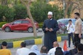 A mosque preacher Imam performs Eid Al Fetr Khutbah (sermon) in an open air space near the mosque,