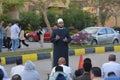 A mosque preacher Imam performs Eid Al Fetr Khutbah (sermon) in an open air space near the mosque,