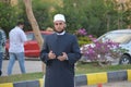 A mosque preacher Imam performs Eid Al Fetr Khutbah (sermon) in an open air space near the mosque,