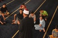 A mosque preacher Imam performs a religious Khutbah (sermon) for young Muslim children inside a mosque