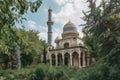 mosque with soaring minarets and intricate tilework, surrounded by greenery