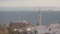 Mosque stands on background of sea. Action. Beautiful mosque on sea coast surrounded by seagulls. Old Turkish mosque on Royalty Free Stock Photo