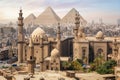 The Mosque of Sultan Hassan and the Great Pyramids of Giza, Cairo skyline, Egypt Royalty Free Stock Photo