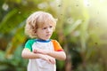 Mosquito on kids skin. Insect bite repellent Royalty Free Stock Photo