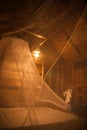 Mosquito net over bed in the guesthouse of Khao Sok sanctuary, Royalty Free Stock Photo