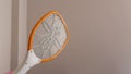 A mosquito swatter in the hand Going to hit mosquitoes by the