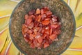 Moss Agate hand carved polished bowl from Morocco with tumbled Carnelian chips from Brazil in the middle of a circle