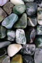 Moss agate heap stones texture on white light background Royalty Free Stock Photo