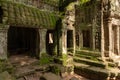 Moss-covered columns and statues by temple doorway