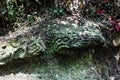 Moss covered sculptures in the forest, Goa Gajah Elephant Cave complex, Bali Royalty Free Stock Photo