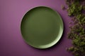 Moss Green Monochrome Plate On Plum Purple Background, Top View. Generative AI