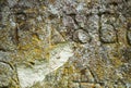 Moss-grown surface of the old stone cross Royalty Free Stock Photo