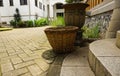 A mossy clay pot and bamboo basket abandoned at garden photo taken in Lawang Sewu Semarang Indonesia