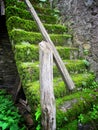 Mossy stairs on old stone building