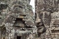 Mossy stone face of ancient buddhist temple Bayon in Angkor Wat complex, Cambodia. Ancient architecture Royalty Free Stock Photo