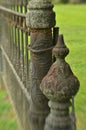 Mossy weathered vintage iron fence