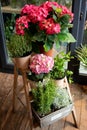 Flowers on a leg in the interior of the restaurant for a celebration shop floristry or wedding