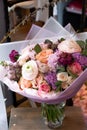 Bouquet of flowers on a leg in the interior of the restaurant for a celebration shop floristry or wedding salon