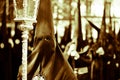 Hooded penitents dressed in black travel through the cities during Easter Holy Week